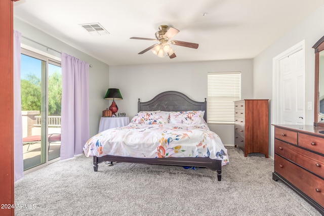 bedroom featuring light carpet, access to exterior, and ceiling fan