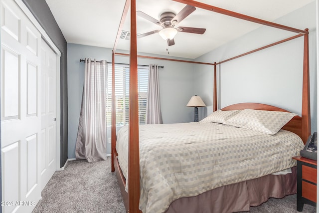 carpeted bedroom with a closet and ceiling fan