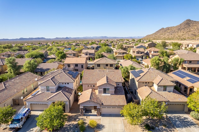 birds eye view of property with a mountain view