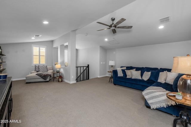 living room featuring carpet floors, ceiling fan, and lofted ceiling