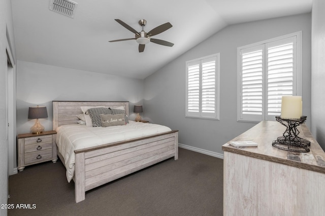 bedroom featuring ceiling fan, dark carpet, and vaulted ceiling