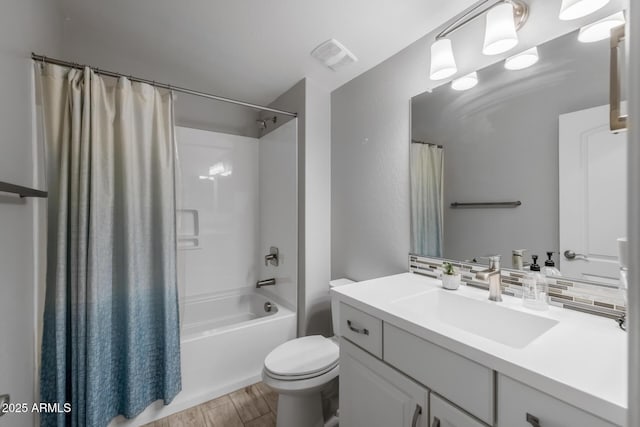 full bathroom with vanity, backsplash, hardwood / wood-style flooring, toilet, and shower / bathtub combination with curtain