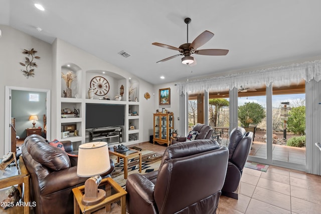 living room with visible vents, built in shelves, a ceiling fan, light tile patterned flooring, and lofted ceiling