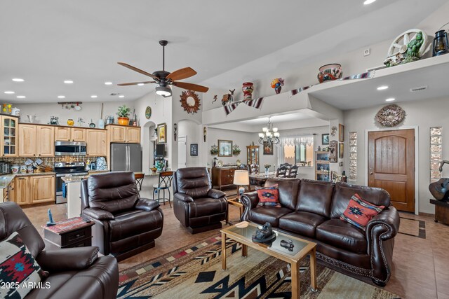 living area featuring visible vents, light tile patterned flooring, recessed lighting, vaulted ceiling, and ceiling fan with notable chandelier