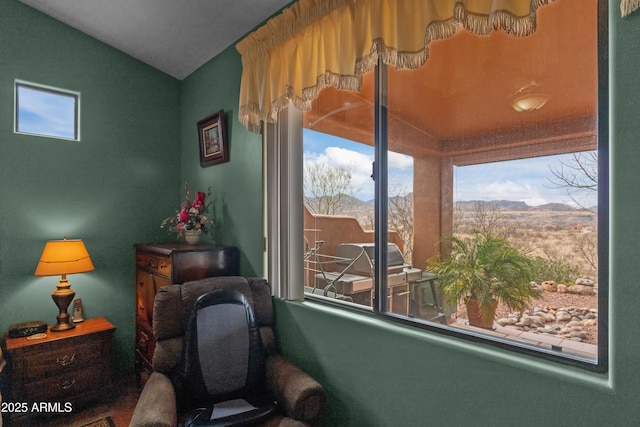 home office featuring a mountain view and lofted ceiling