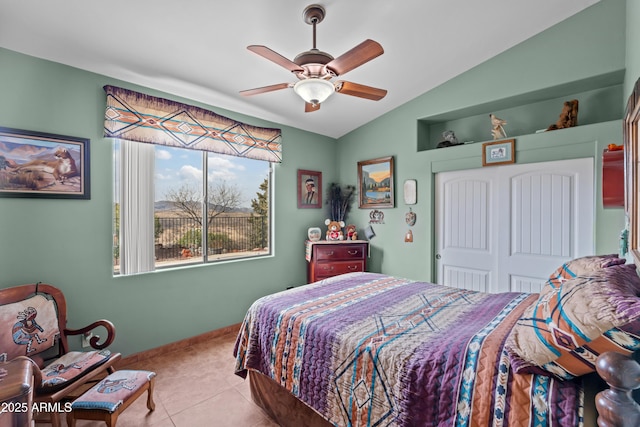 bedroom with tile patterned floors, baseboards, lofted ceiling, and a ceiling fan