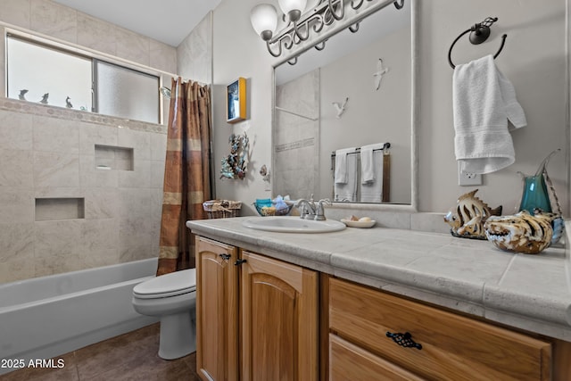 full bathroom with tile patterned flooring, toilet, vanity, and shower / tub combo