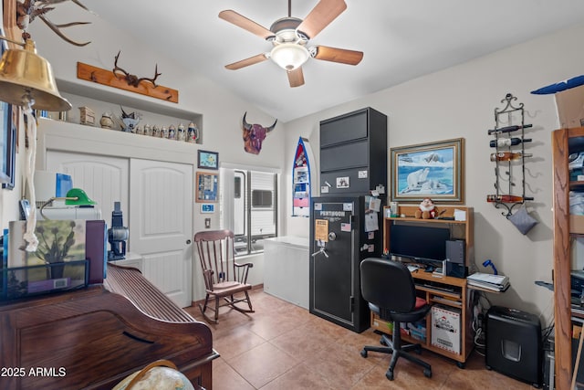 office space with light tile patterned flooring, ceiling fan, and vaulted ceiling