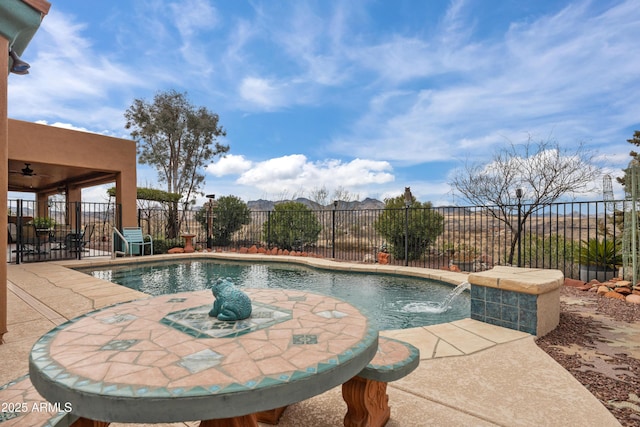 view of swimming pool featuring a patio, fence, and a fenced in pool