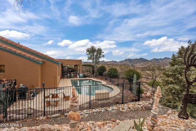 view of swimming pool with a fenced in pool, fence, area for grilling, a patio area, and a mountain view