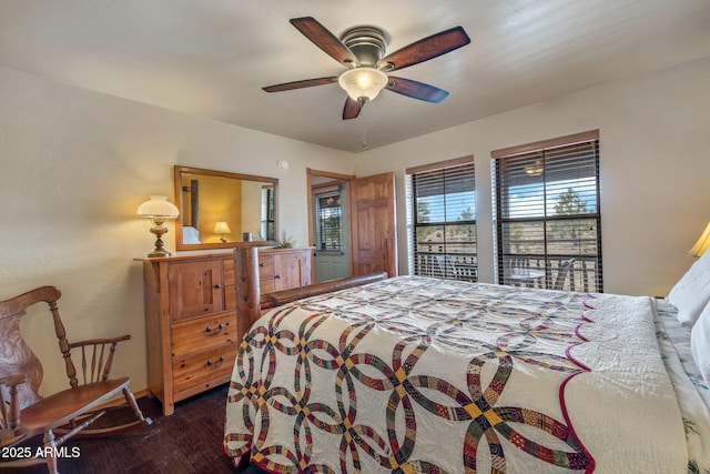 bedroom with access to exterior, dark wood-type flooring, and ceiling fan