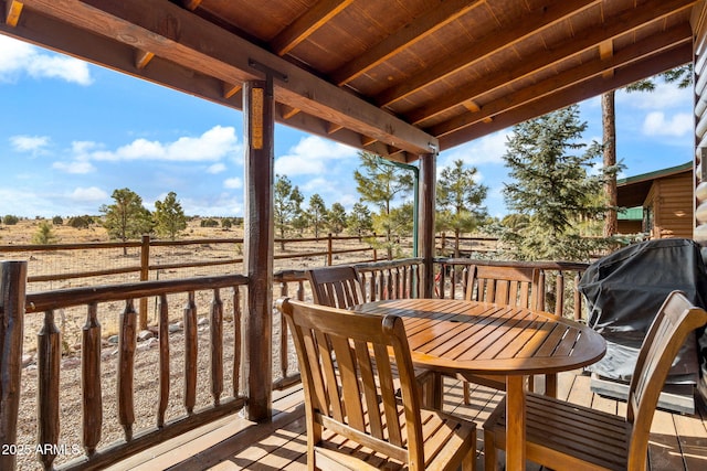 wooden deck featuring a rural view