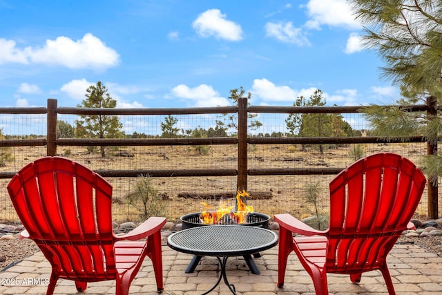 view of patio / terrace with an outdoor fire pit