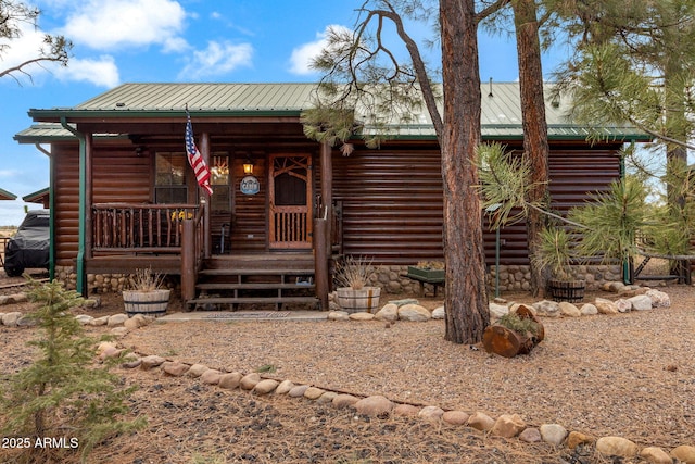 log cabin featuring a porch