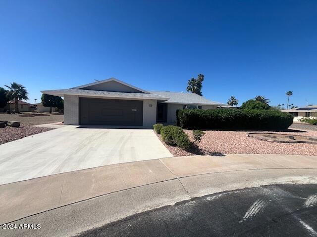 ranch-style home with a garage