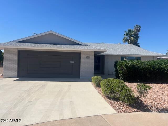 single story home featuring a garage