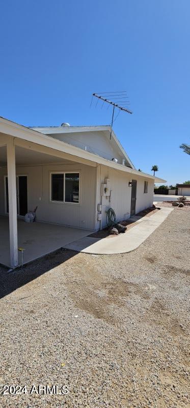 rear view of property featuring a patio