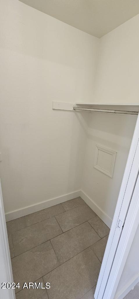 spacious closet featuring tile patterned flooring