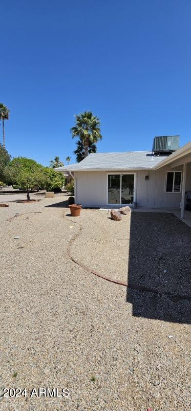 back of house featuring cooling unit and a patio area