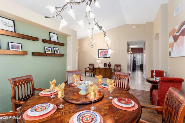 3797 N 156th Dr N, Goodyear, AZ 85395 - dining area featuring vaulted ceiling, a chandelier, and visible vents