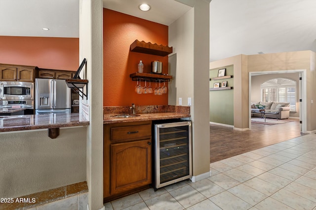 3797 N 156th Dr N, Goodyear, AZ 85395 - bar featuring wine cooler, recessed lighting, a sink, wet bar, and appliances with stainless steel finishes