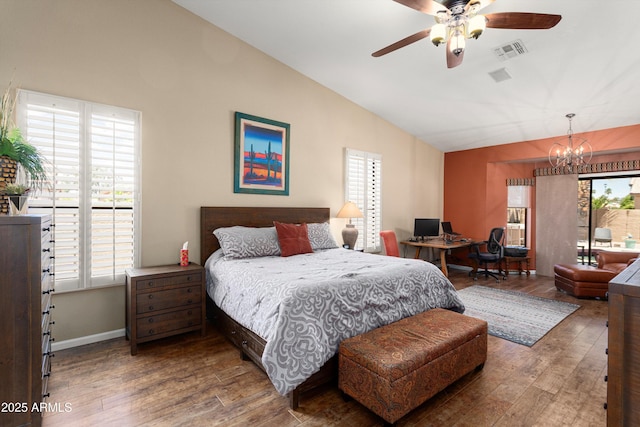3797 N 156th Dr N, Goodyear, AZ 85395 - bedroom with visible vents, wood-type flooring, lofted ceiling, an inviting chandelier, and access to outside