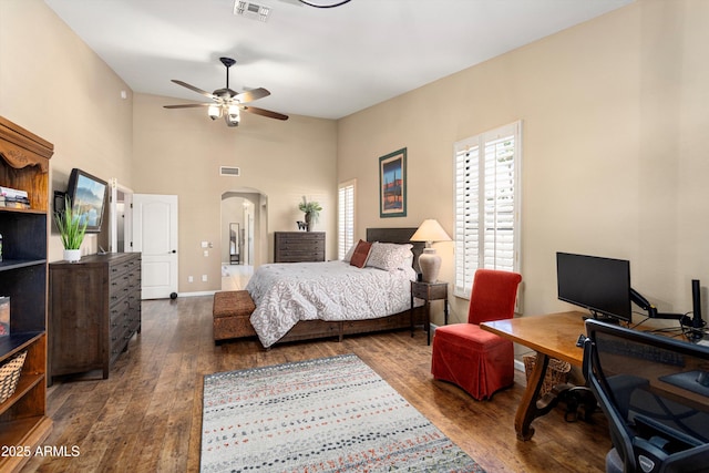3797 N 156th Dr N, Goodyear, AZ 85395 - bedroom featuring arched walkways, visible vents, and wood finished floors