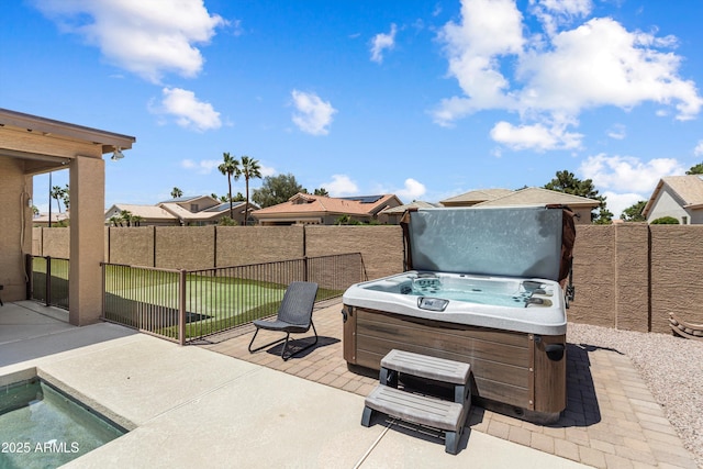 3797 N 156th Dr N, Goodyear, AZ 85395 - view of patio featuring a fenced backyard and a hot tub