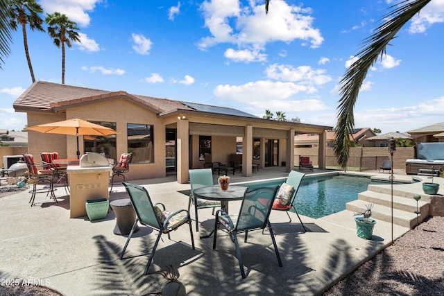 3797 N 156th Dr N, Goodyear, AZ 85395 - view of swimming pool with fence, a fenced in pool, outdoor dining area, and a patio area