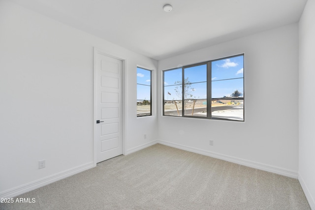 5875 N 193rd Dr, Litchfield Park, AZ 85340 - empty room featuring baseboards and light carpet