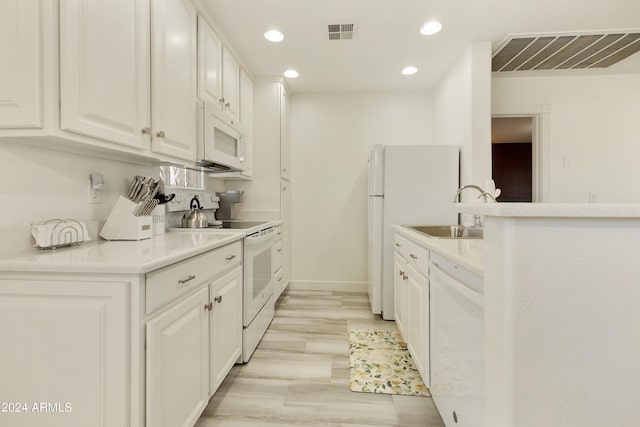 14910 N Kings Way Unit 206, Fountain Hills, AZ 85268 - kitchen featuring white appliances, a sink, recessed lighting, white cabinetry, and light countertops