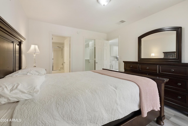 14910 N Kings Way Unit 206, Fountain Hills, AZ 85268 - bedroom featuring wood finished floors and ensuite bath