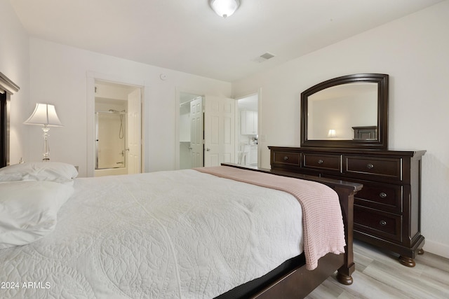 14910 N Kings Way Unit 206, Fountain Hills, AZ 85268 - bedroom with light wood-type flooring, baseboards, and connected bathroom