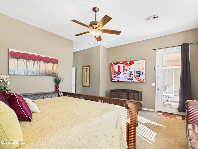 carpeted bedroom featuring access to exterior, baseboards, visible vents, and ceiling fan