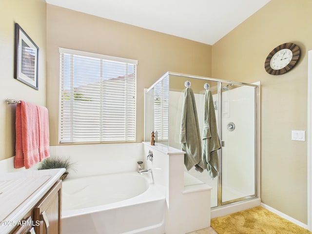 bathroom with vanity, a bath, and a shower stall