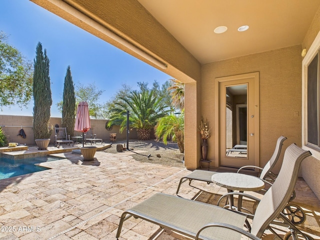 view of patio / terrace featuring a fenced in pool and a fenced backyard