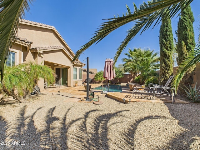 view of yard featuring a fenced in pool, a patio, and a fenced backyard