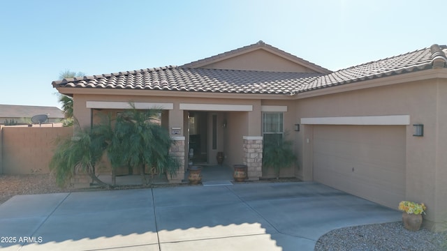 view of front of house with stucco siding and a tile roof