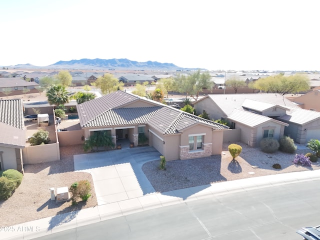 drone / aerial view featuring a mountain view and a residential view