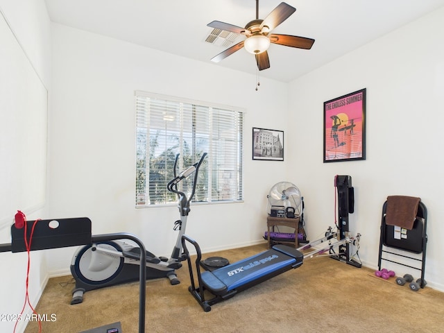 workout area featuring carpet flooring, visible vents, baseboards, and a ceiling fan