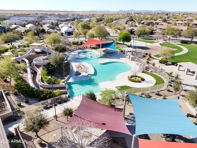 birds eye view of property with a residential view