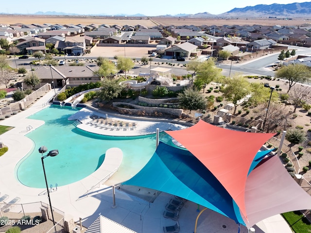 view of pool with a mountain view and a residential view