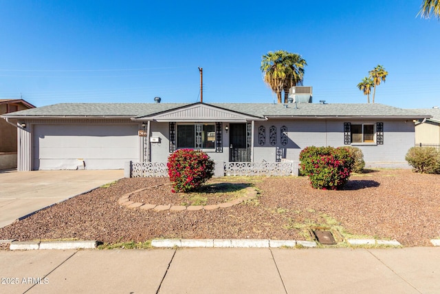 single story home featuring a garage and driveway