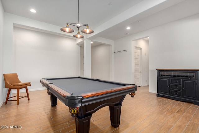 recreation room with billiards and light hardwood / wood-style floors