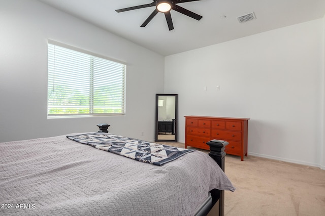 bedroom featuring ceiling fan and light colored carpet