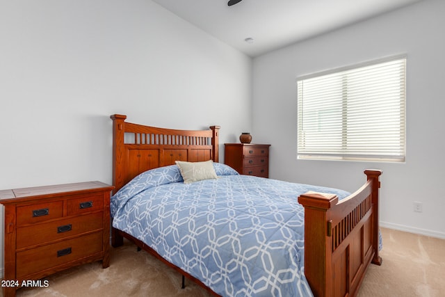 carpeted bedroom featuring lofted ceiling