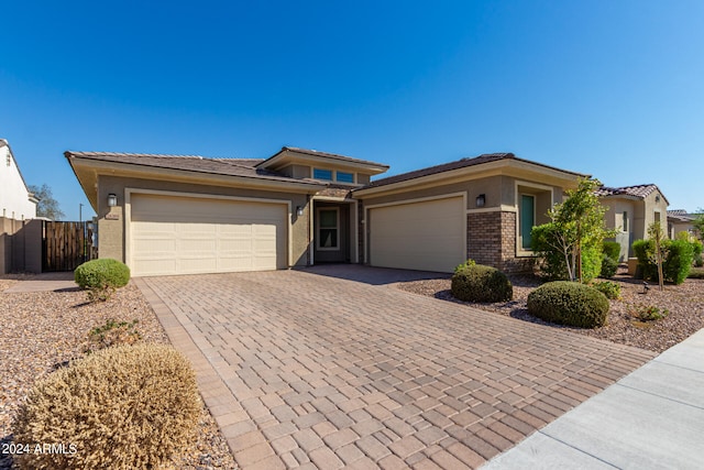 prairie-style home featuring a garage