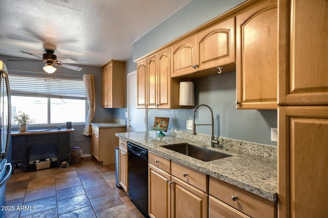 kitchen featuring ceiling fan, light brown cabinetry, dishwasher, a sink, and light stone counters
