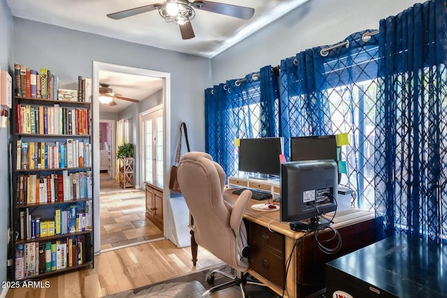 office area featuring light wood-style floors and ceiling fan