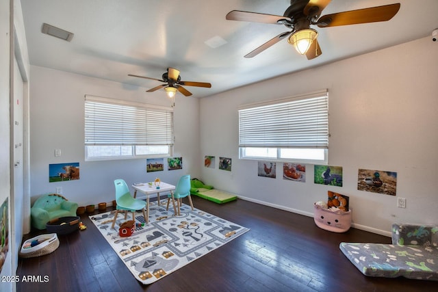 playroom with baseboards, a ceiling fan, and hardwood / wood-style flooring